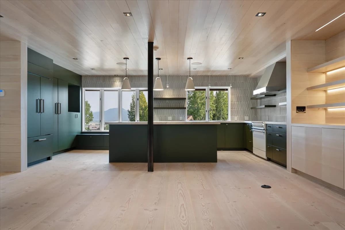Kitchen with dark green cabinetry and wood ceiling