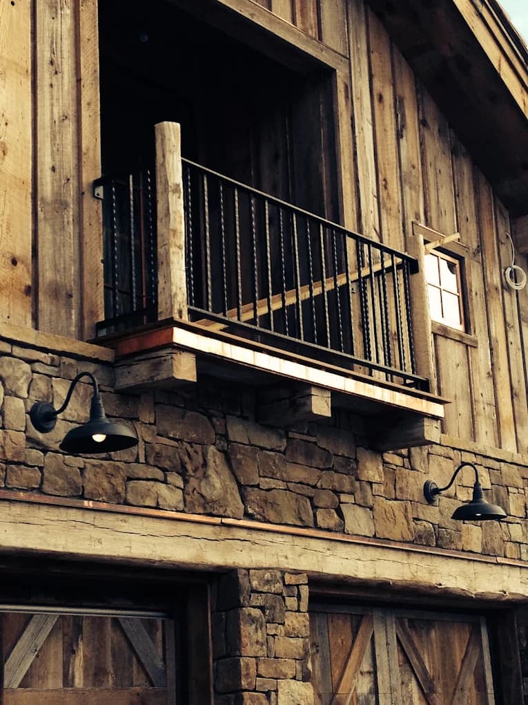 Rustic stone and timber exterior balcony detail